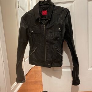 Black faux leather zip up jacket with side pockets. shoes sold separately